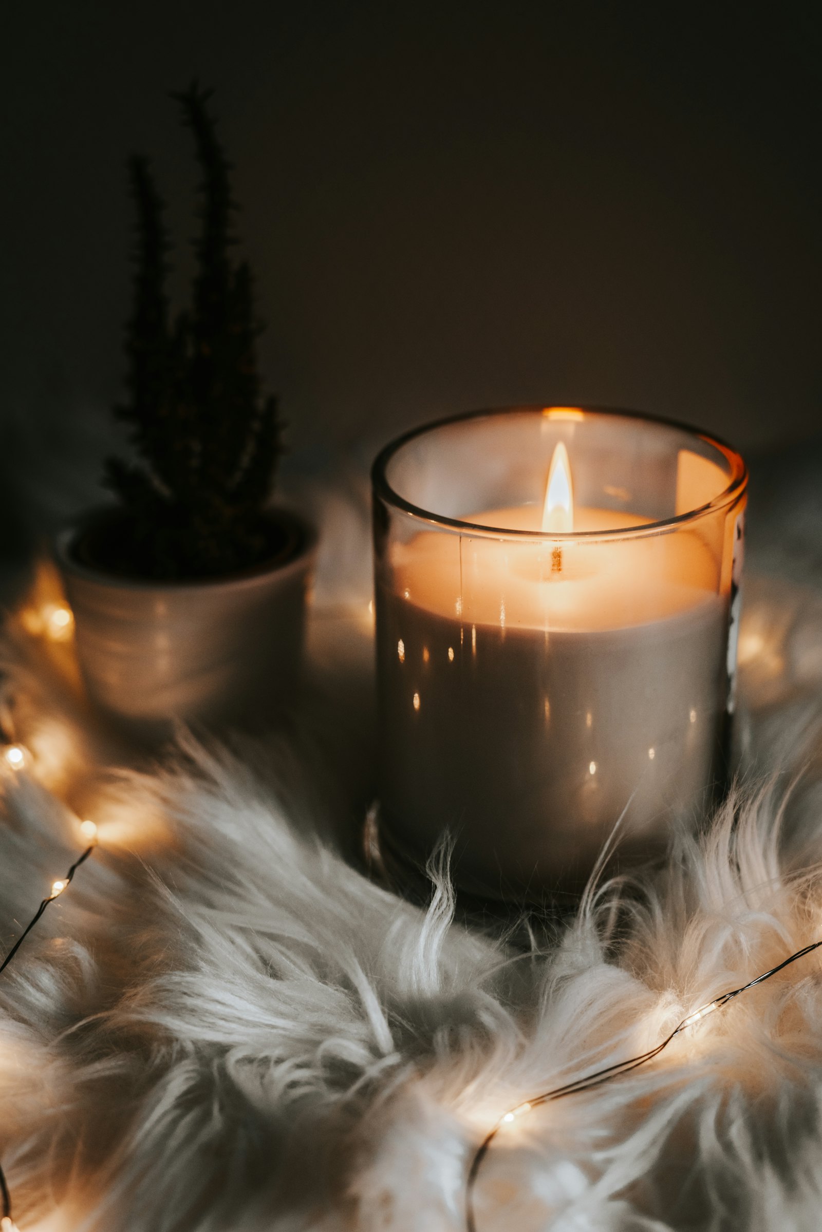 Lit candles in glass jars